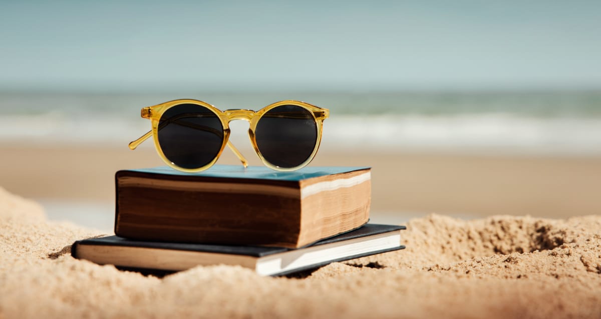 Books on beach sand